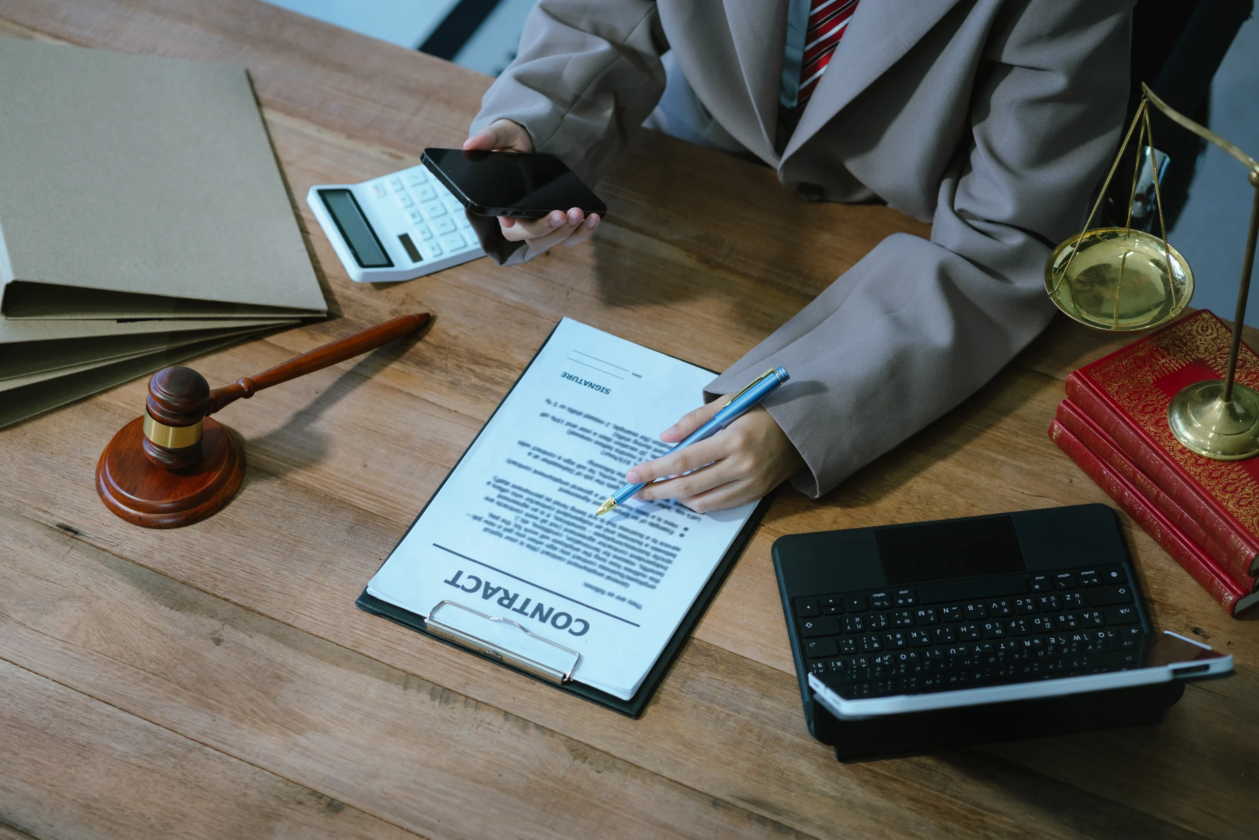 Legal professional signing a contract, securing Government Contractor Registration.