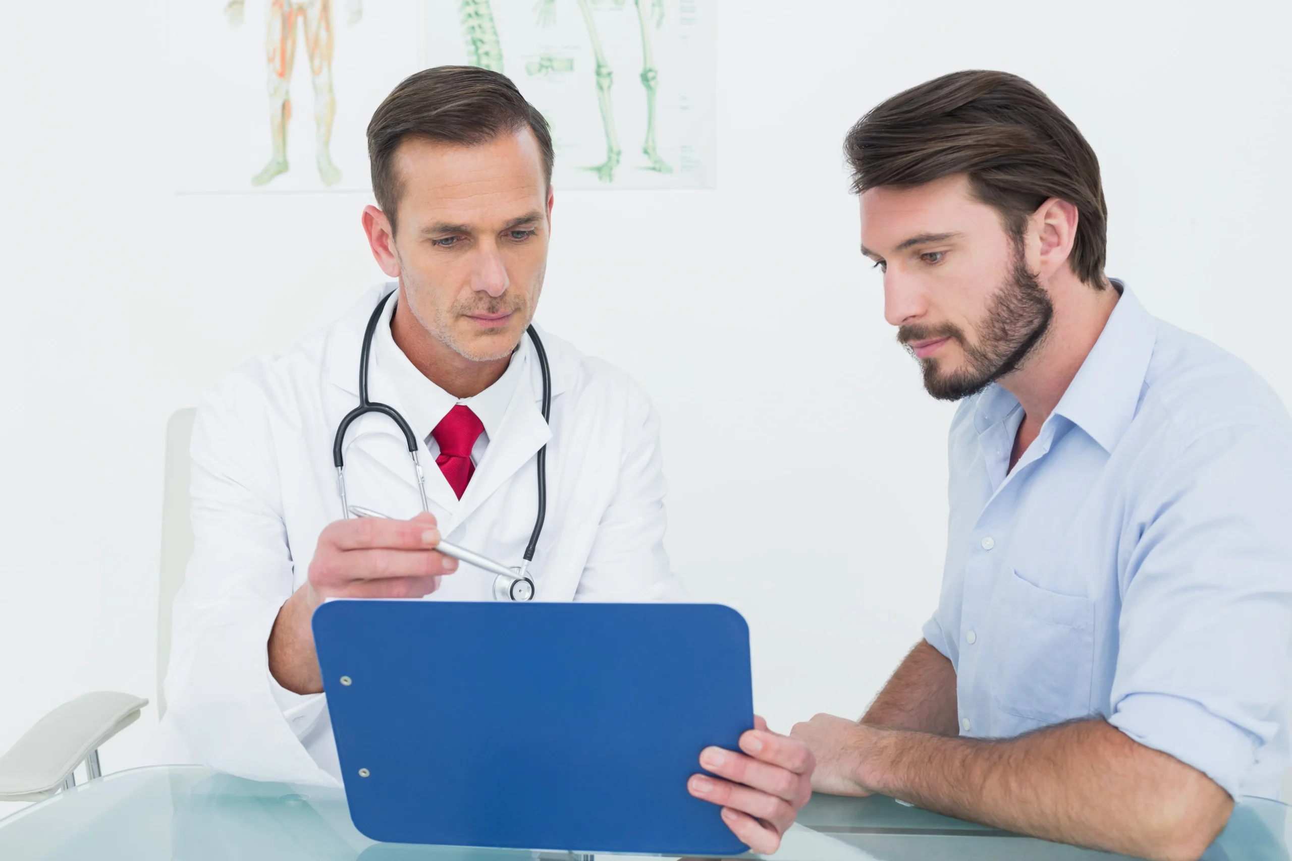 A physician in a white coat reviewing compliance documentation on a clipboard with a colleague, emphasizing the workflow differences between SAM vs OIG screening.