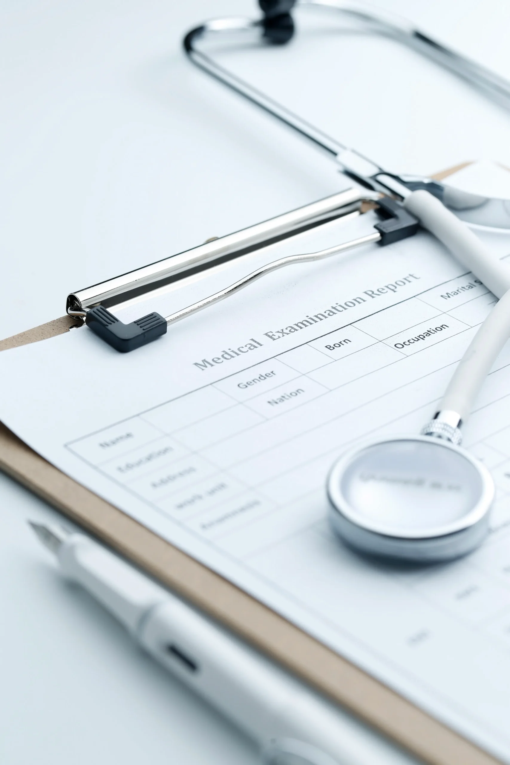 Medical evaluation clipboard and stethoscope used for credentialing and SAM screening services.
